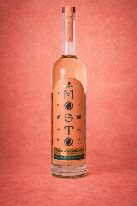 Mosto Tequila Reposado bottle — aged in rare bourbon barrels